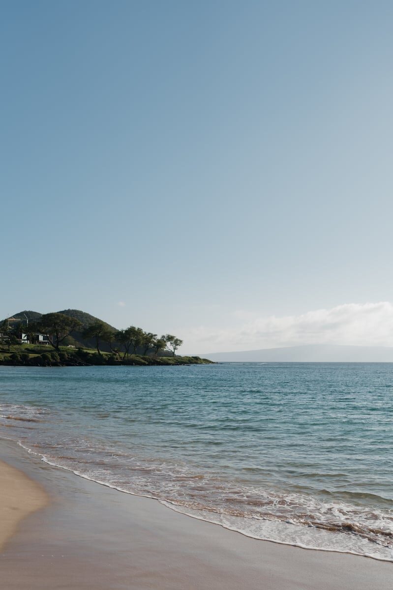 Infinity pool at a Wailea Maui resort overlooking the Pacific Ocean at golden sunset