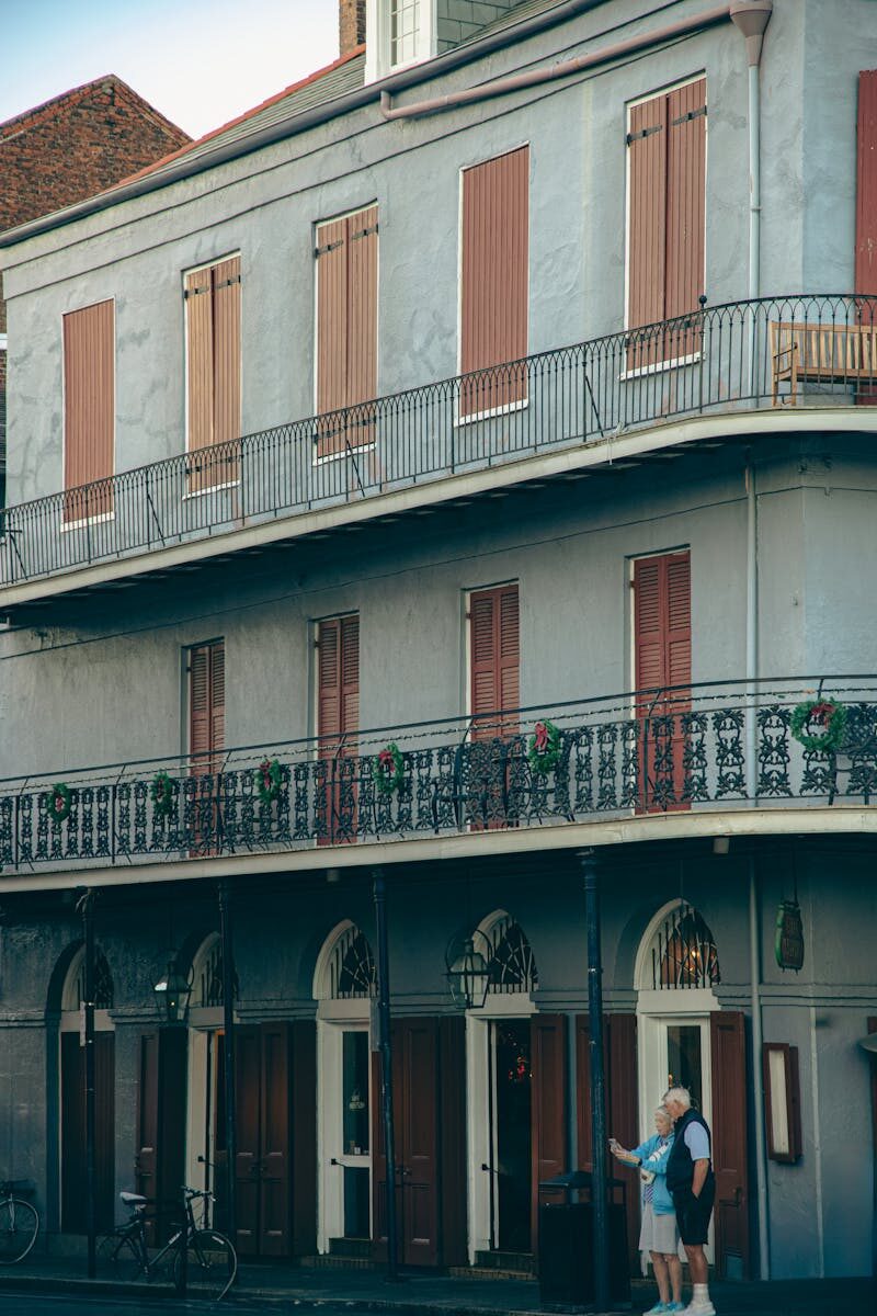 Elegant grand lobby of a historic New Orleans luxury hotel with marble floors and ornate architecture