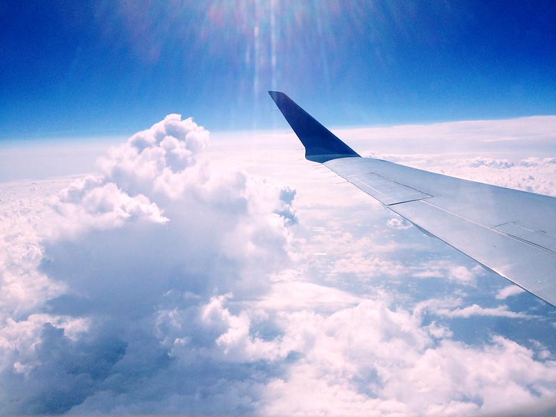View of clouds from an airplane window during a flight