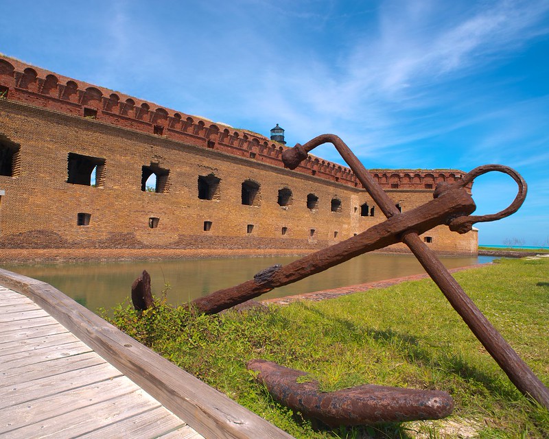 Brick walls of Fort Jefferson rising from clear water at Dry Tortugas National Park
