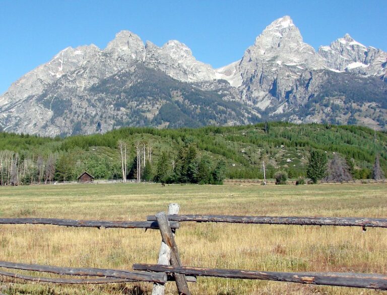The jagged Teton Range rising sharply above the valley floor in Grand Teton National Park