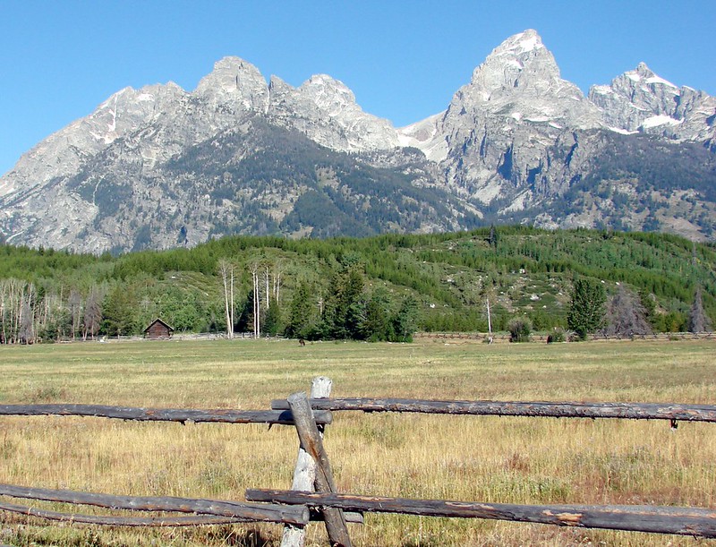 The jagged Teton Range rising sharply above the valley floor in Grand Teton National Park