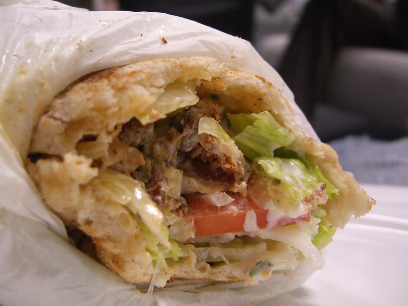 Plate of Greek souvlaki and gyros in warm pita, classic Athens food