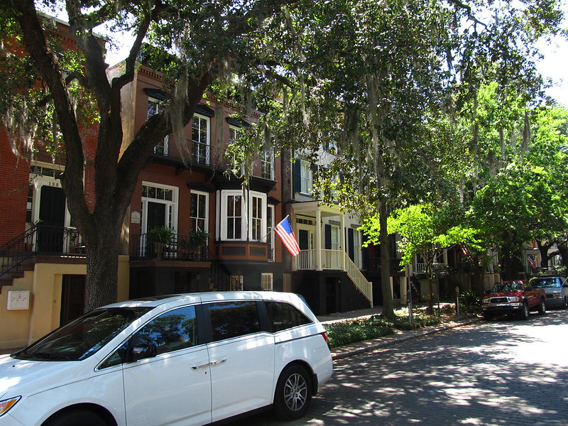 Walking under moss-draped live oaks on Jones Street in Savannah’s Historic District