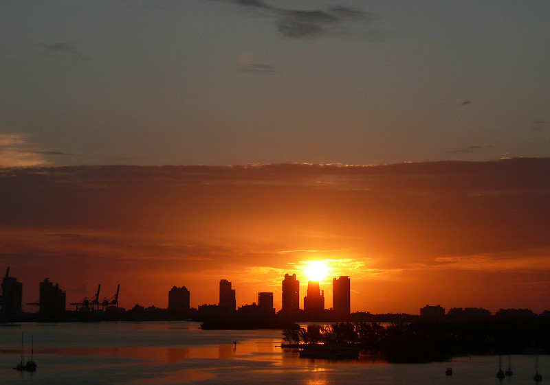 The Miami city skyline viewed from Biscayne Bay waterfront at sunset