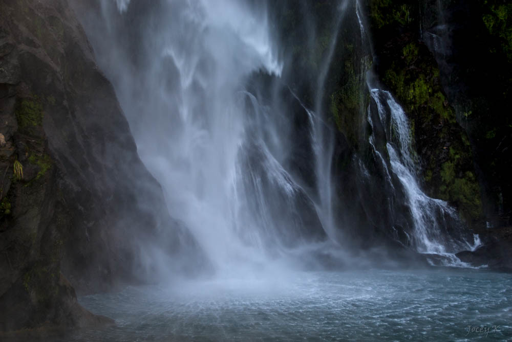 Milford Sound fiord with dramatic waterfalls and cliffs in New Zealand