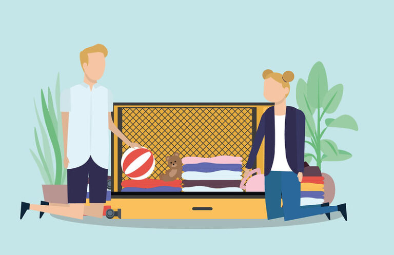An open suitcase neatly packed with folded clothes and travel items