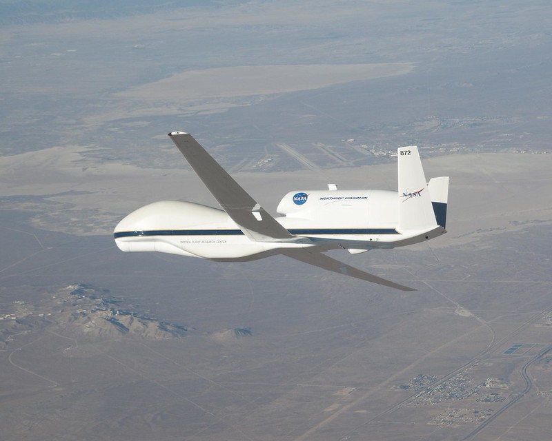 View of an airplane wing above the clouds during a flight