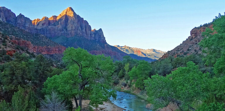 Sunrise lighting up the Watchman peak above the Virgin River in Zion National Park