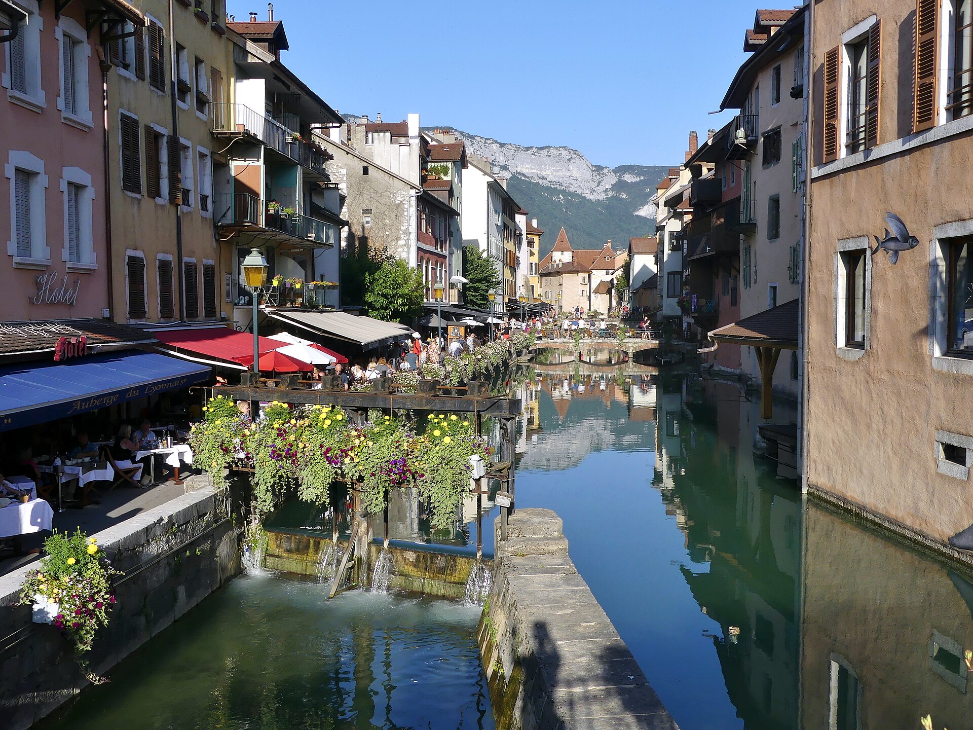 The Thiou canal winding through Annecy's medieval old town in the evening