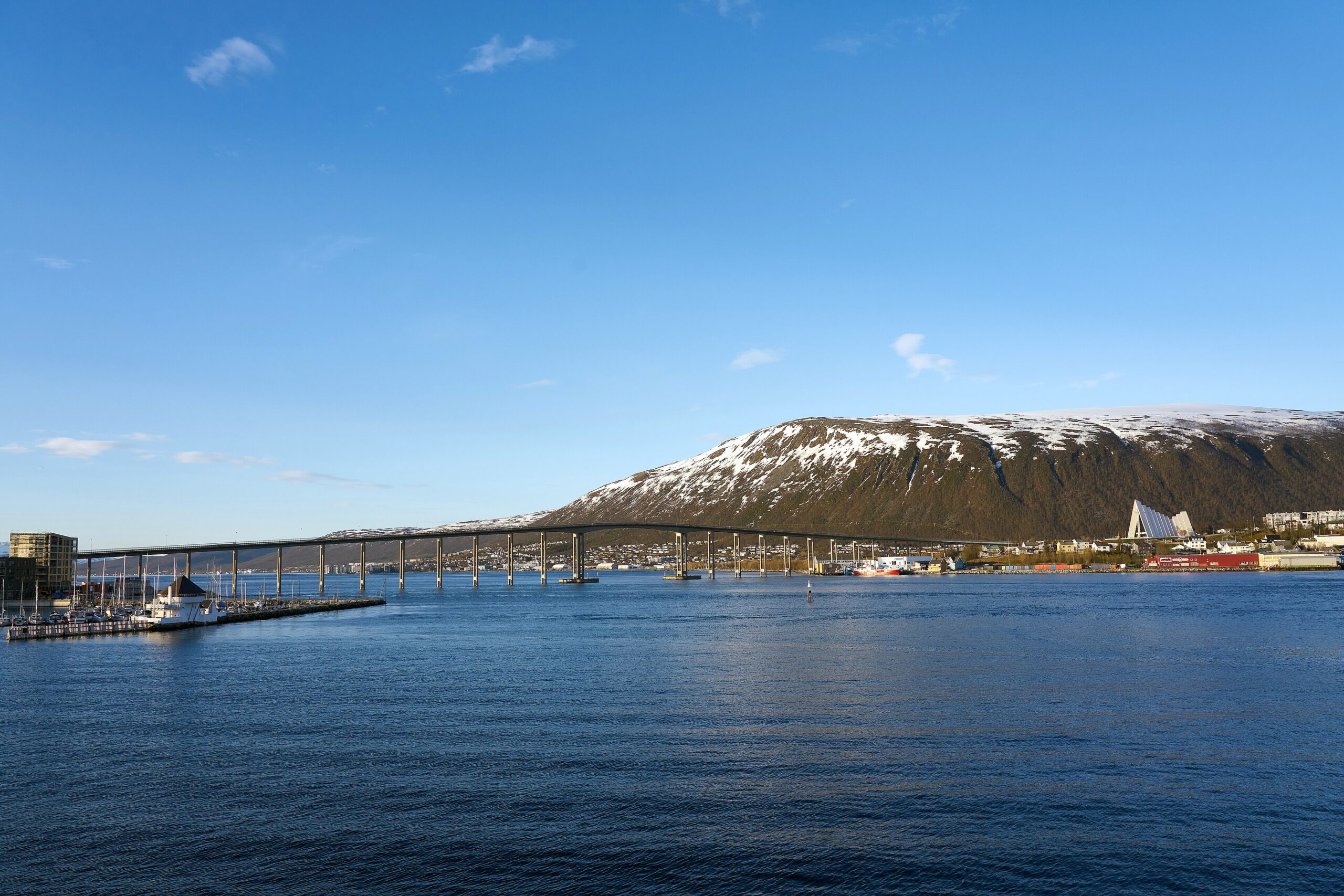 The white Arctic Cathedral and bridge in Tromsdalen, Tromso, Norway