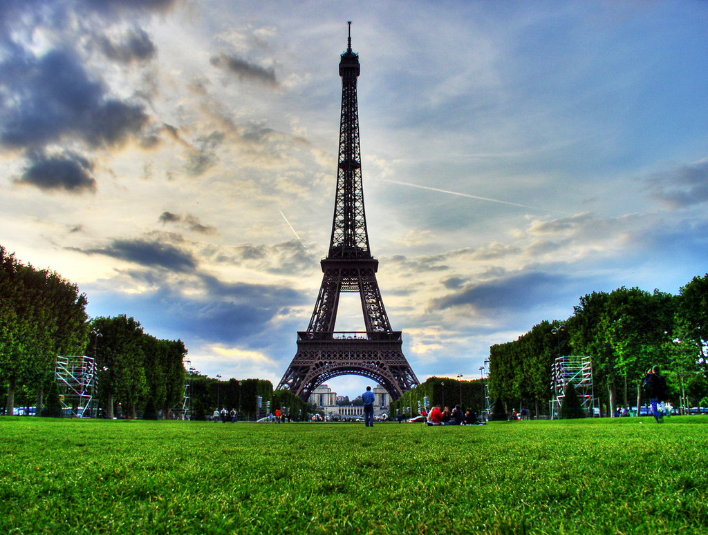 The Eiffel Tower rising above the green lawn of the Champ de Mars in Paris