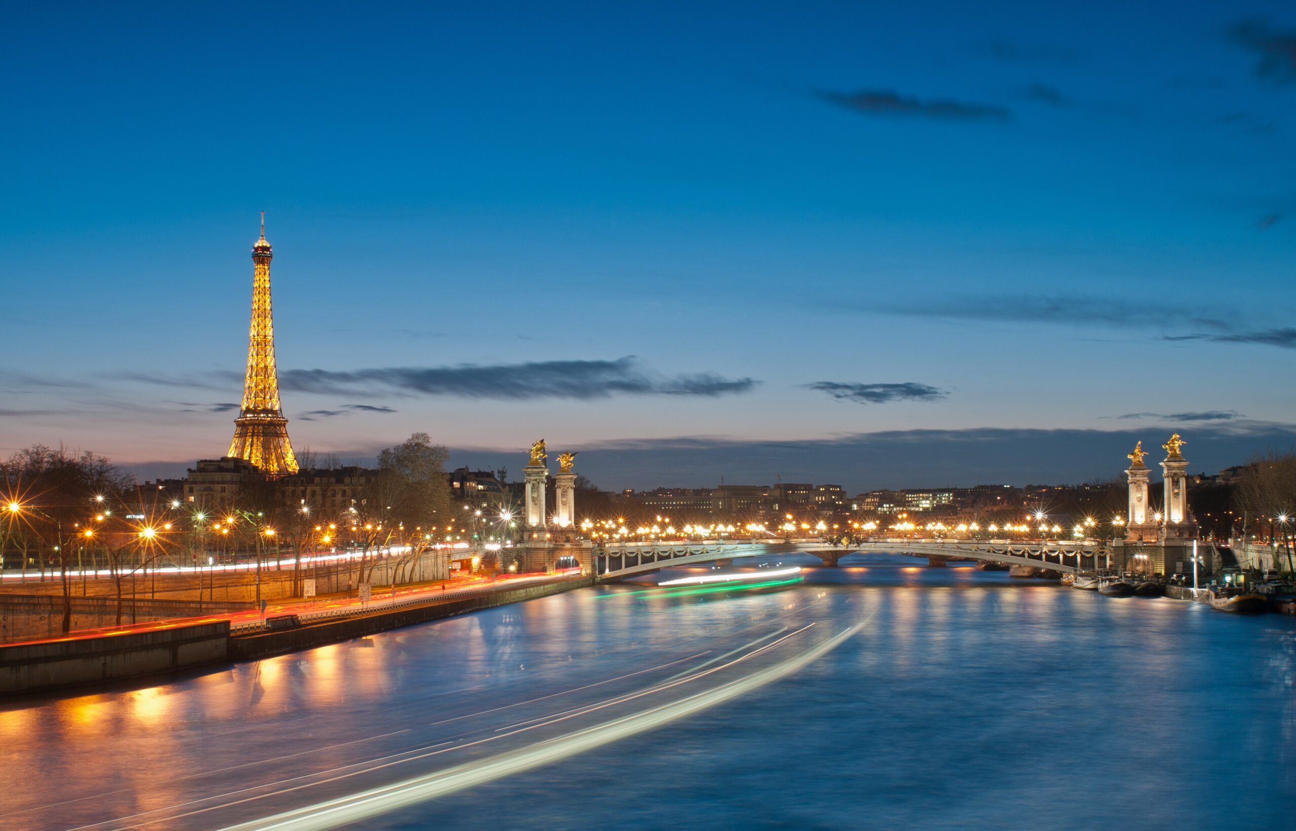 The Eiffel Tower and the golden Pont Alexandre III bridge in Paris, France