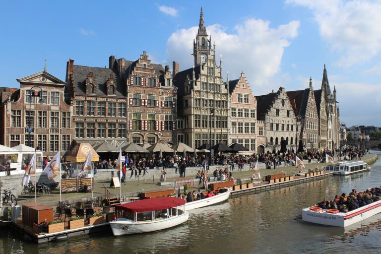 Medieval guild houses lining the Graslei waterfront on the canal in Ghent Belgium