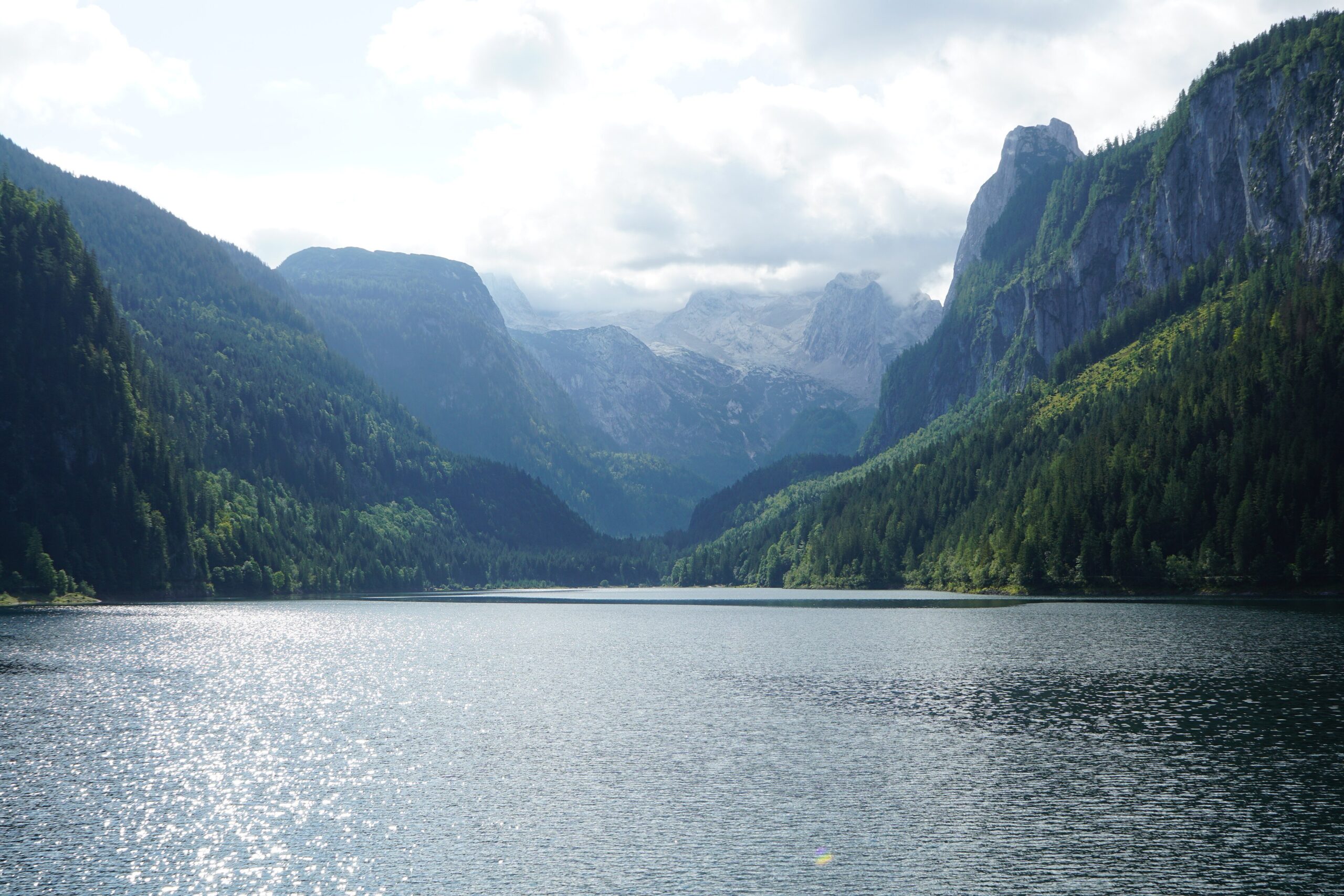 The Dachstein glacier reflected in the still green water of Lake Gosau near Hallstatt