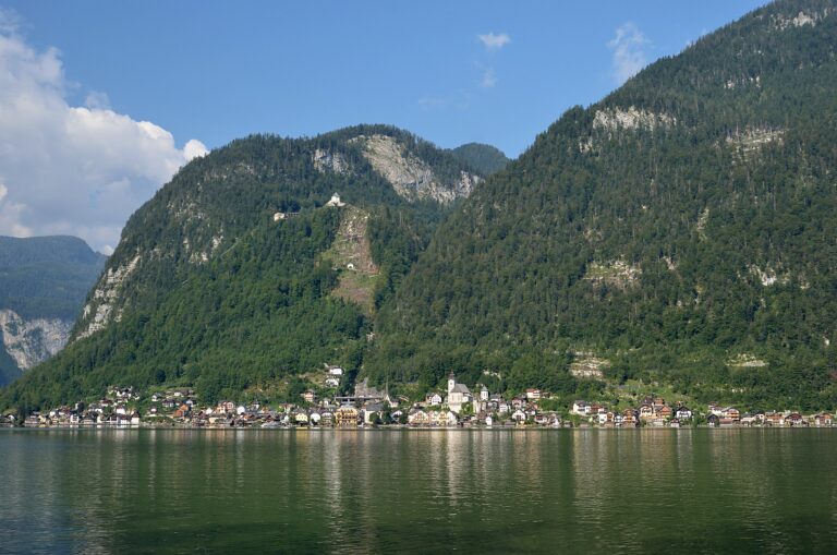 The village of Hallstatt mirrored in Lake Hallstatt beneath the Dachstein mountains
