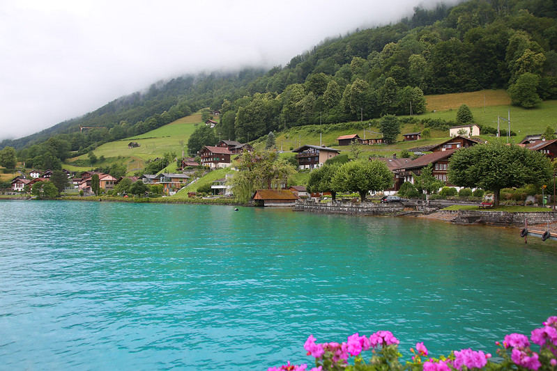 Turquoise water of Lake Brienz with an alpine village near Interlaken