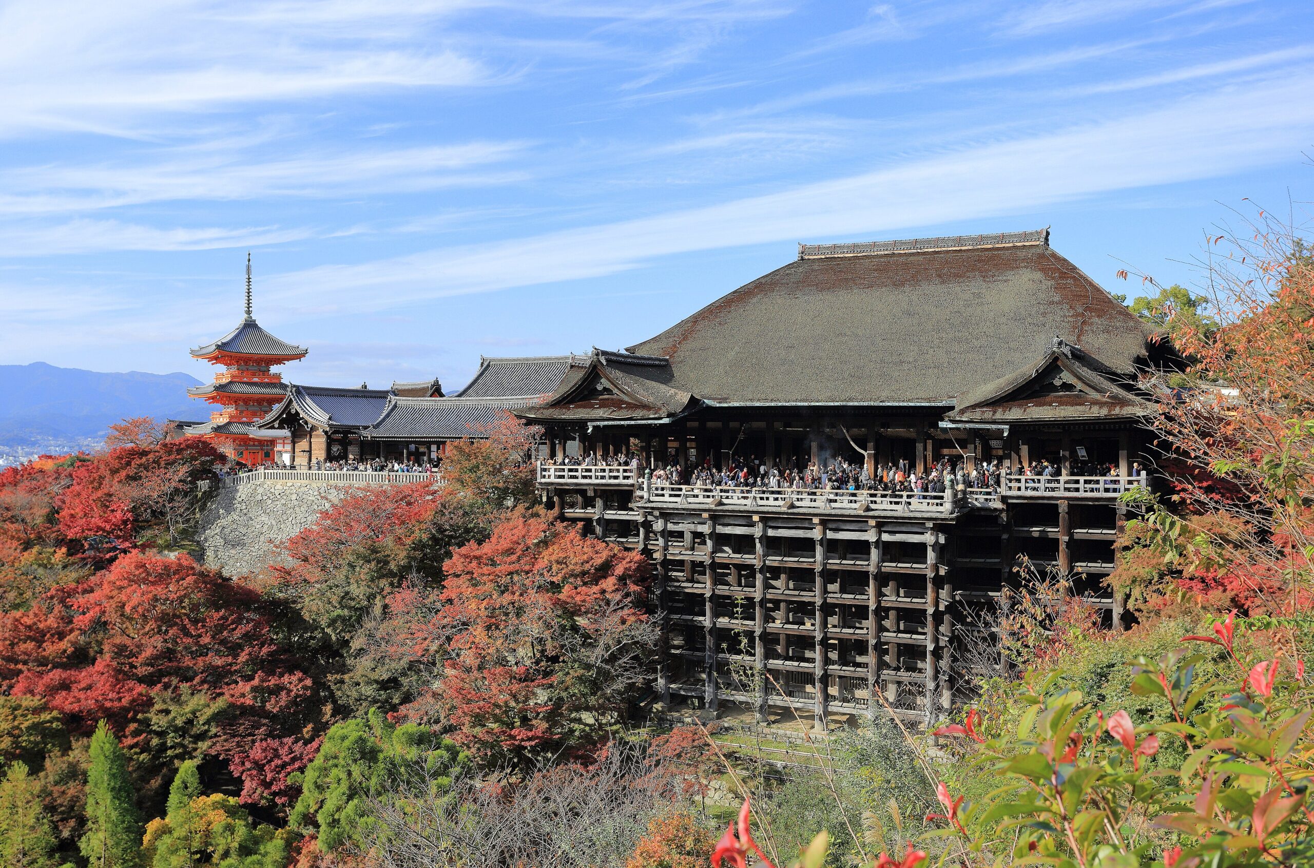 The wooden terrace of Kiyomizu-dera temple among autumn leaves in Kyoto Japan