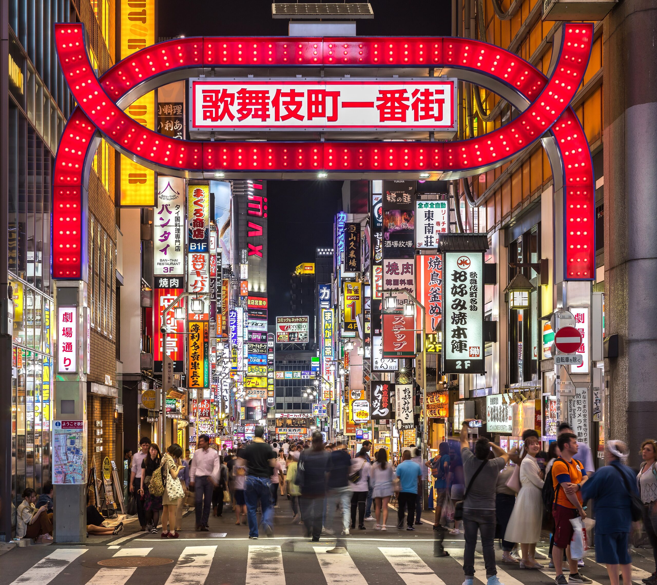 Colorful neon signs lighting up Shinjuku Tokyo at night in Japan