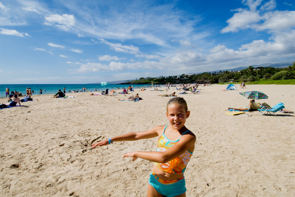 Sunny white-sand beach with turquoise water on the Kona side of Hawaii Big Island