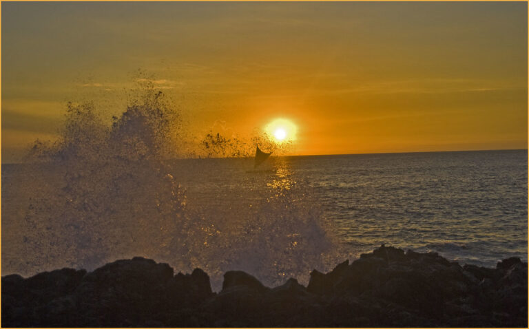 Golden sunset over the ocean along the Kailua-Kona coast on Hawaii Big Island