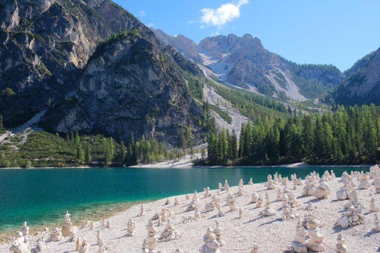 Turquoise water of Lago di Braies below the pale peaks of the Dolomites in South Tyrol, Italy