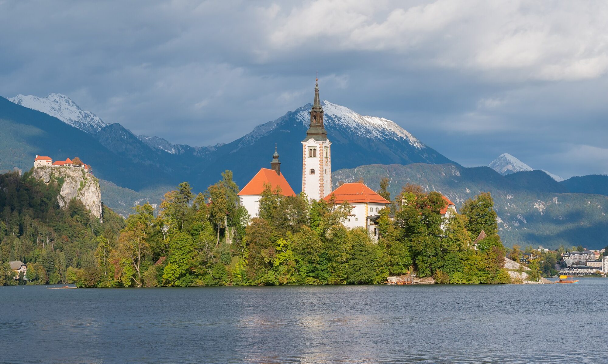 Bled Island and its church on Lake Bled below the clifftop Bled Castle in Slovenia