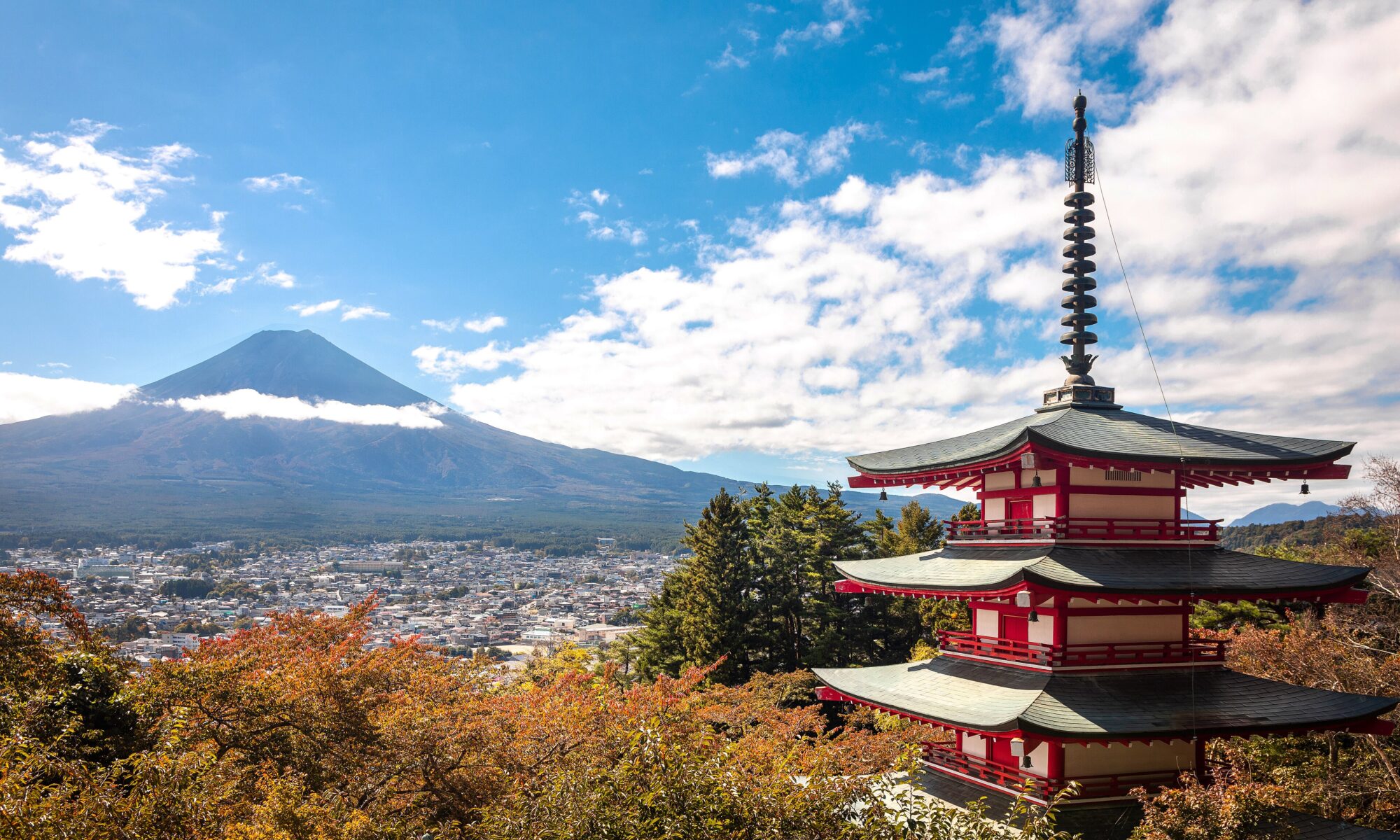 Mount Fuji rising behind the red Chureito Pagoda with autumn colors in Japan