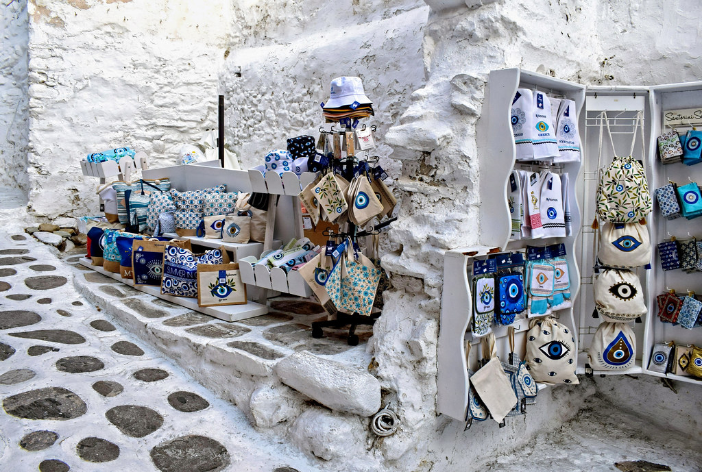 A whitewashed lane with a small shop in Mykonos Town, Greece