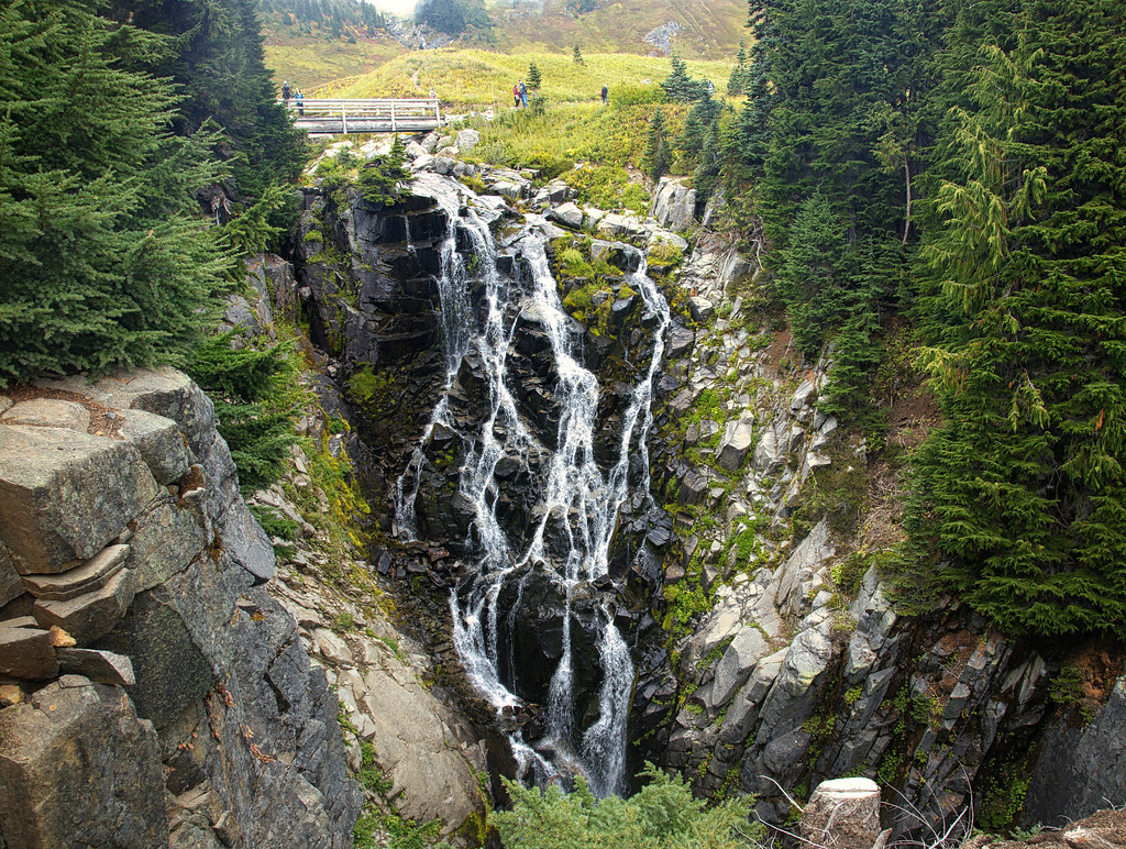 Myrtle Falls cascading with Mount Rainier rising in the distance