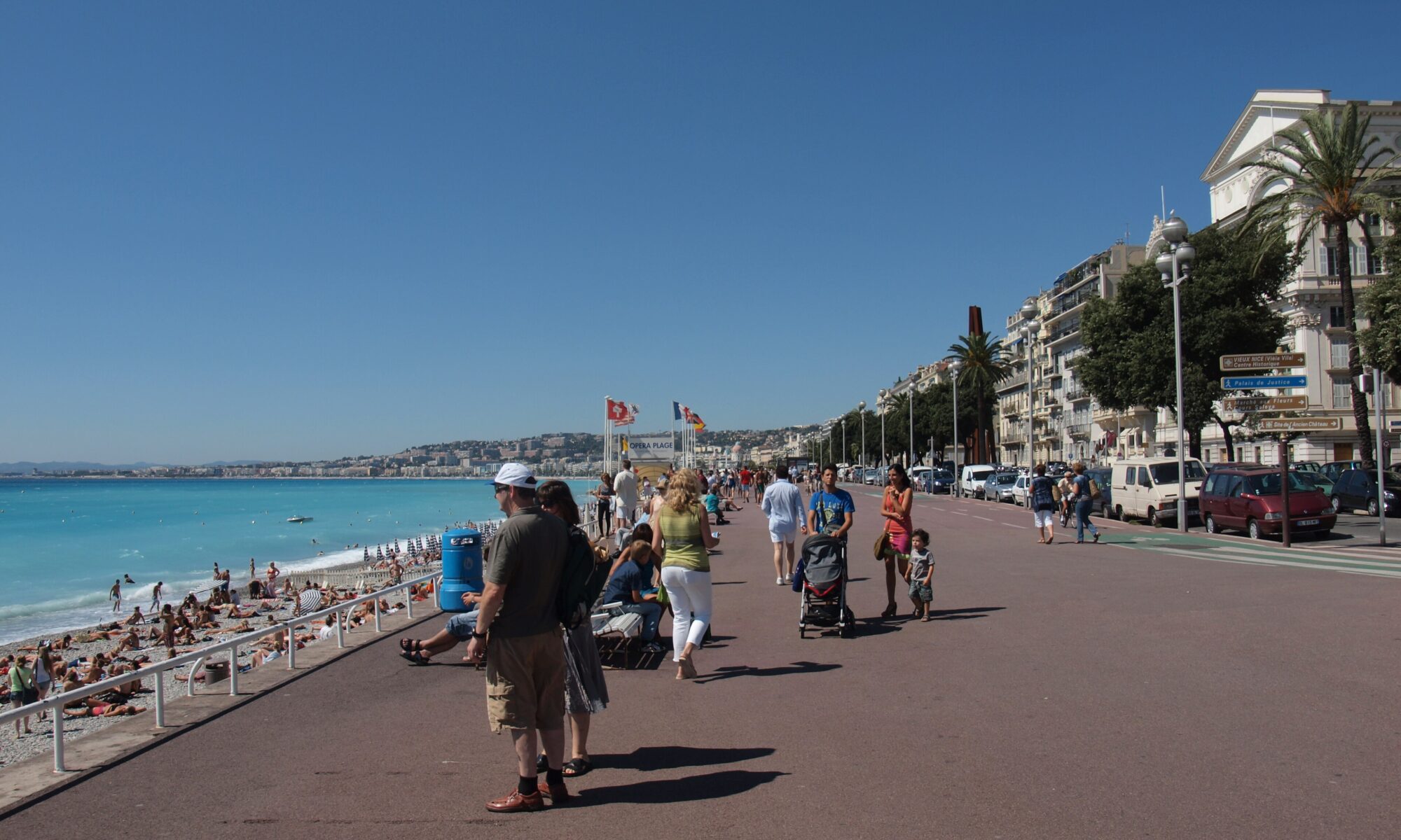 The Promenade des Anglais curving along the blue Baie des Anges in Nice France