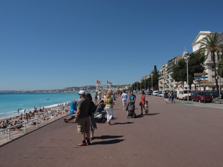 The Promenade des Anglais curving along the blue Baie des Anges in Nice France