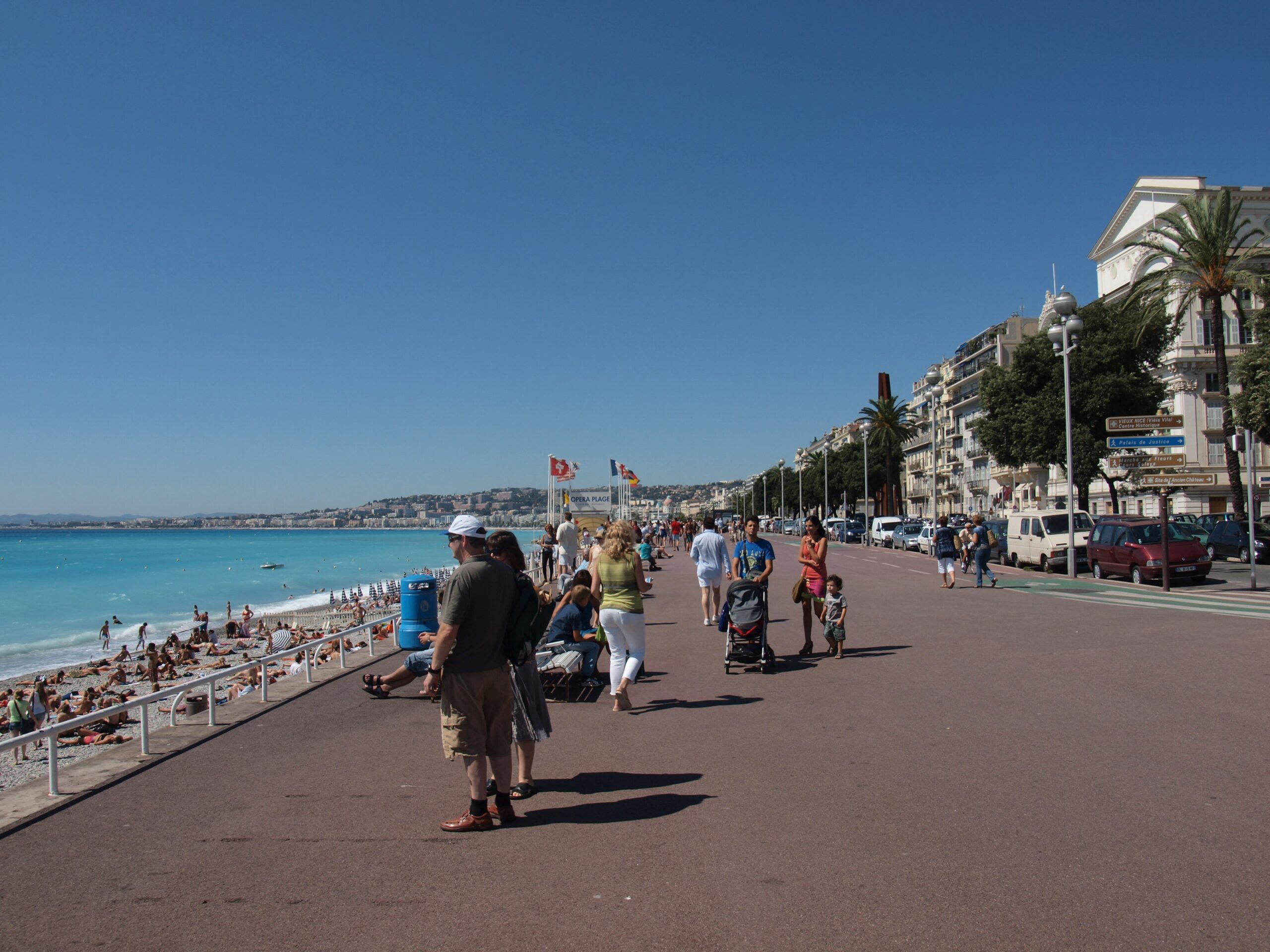 The Promenade des Anglais curving along the blue Baie des Anges in Nice France