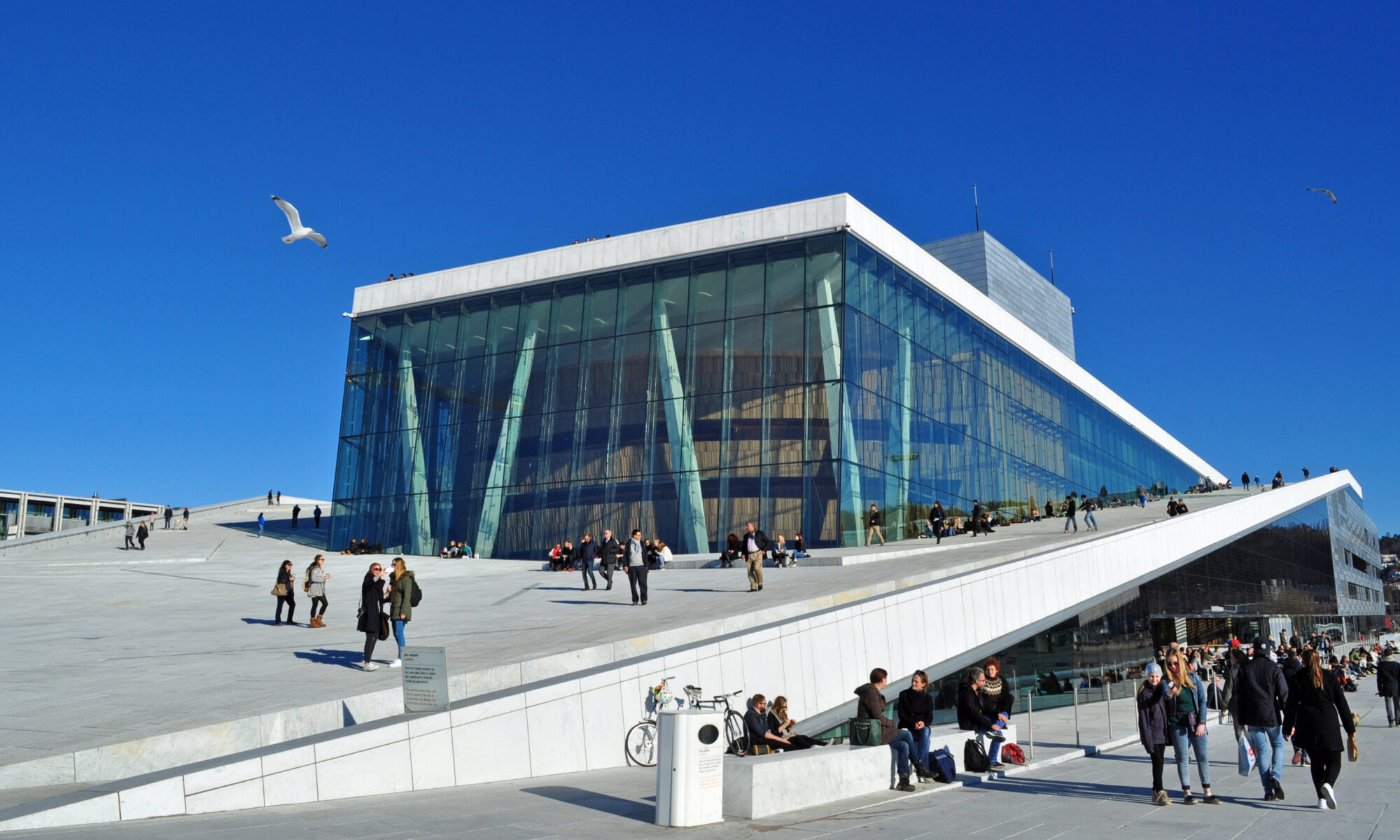 The white marble roof of the Oslo Opera House sloping down into the Oslofjord