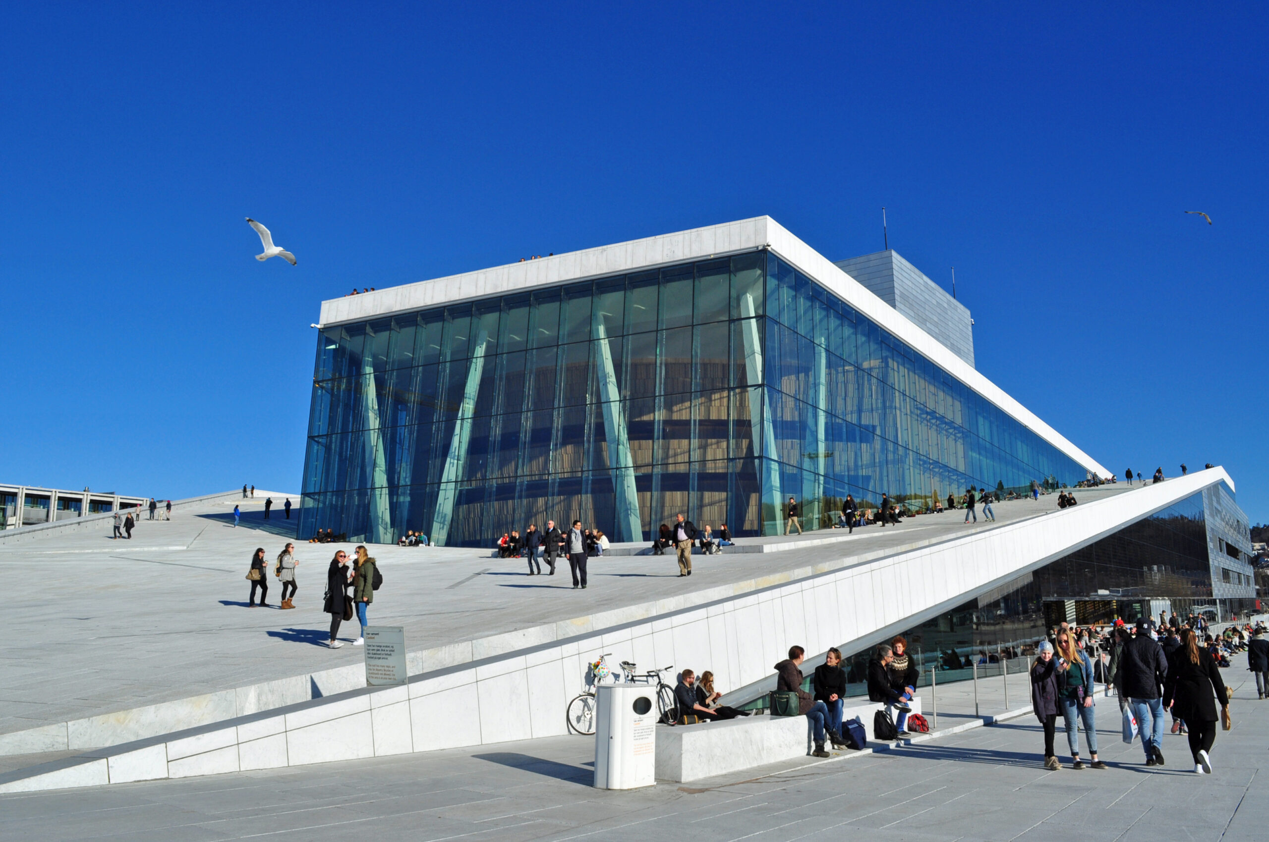 The white marble roof of the Oslo Opera House sloping down into the Oslofjord