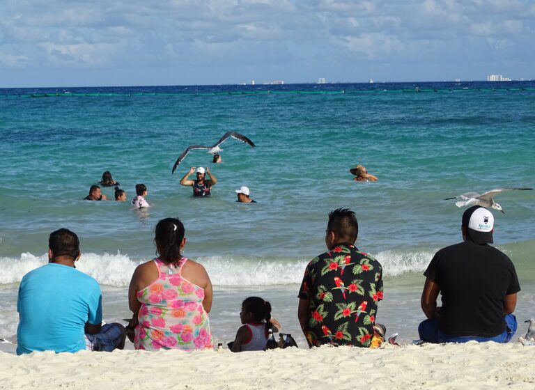 Turquoise Caribbean water and white sand at a Playa del Carmen beach in Mexico