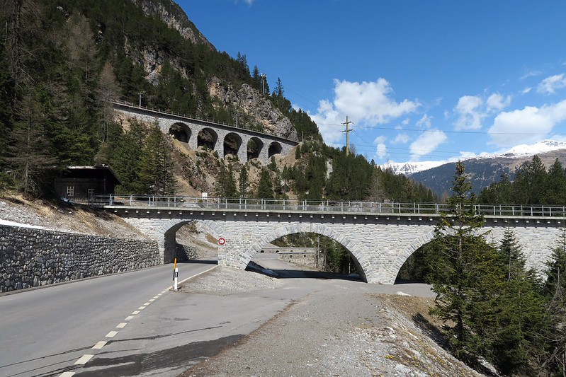 Train winding through Alpine scenery on the Albula Pass in Switzerland