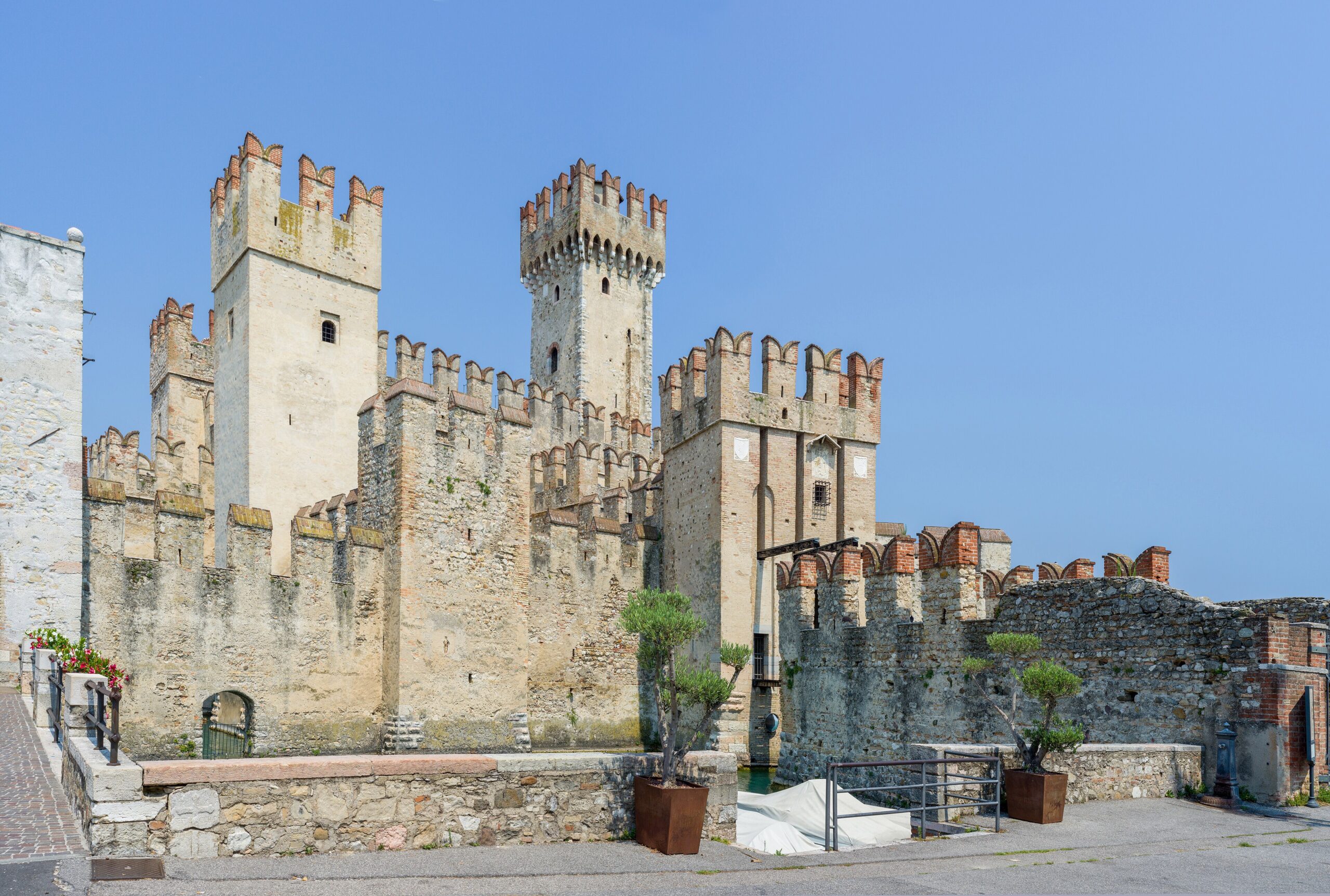 The medieval Scaligero Castle with its moat jutting into Lake Garda at Sirmione