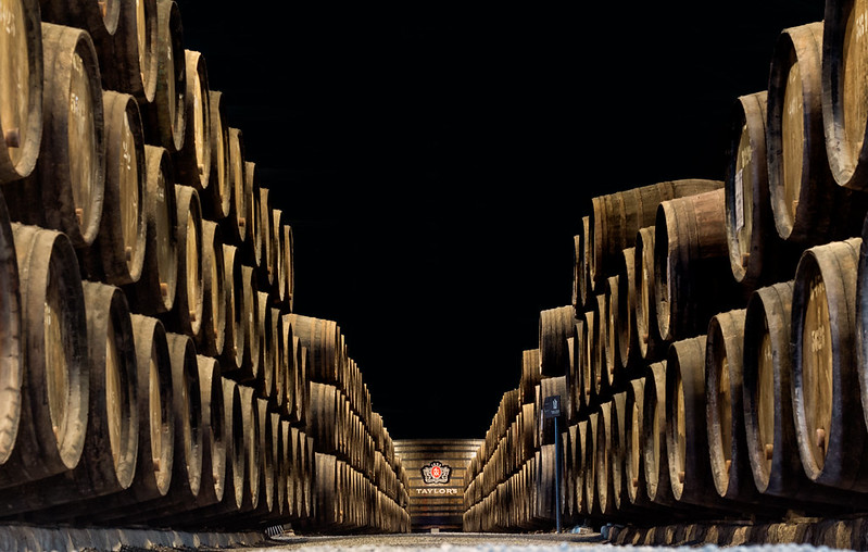 Oak barrels inside Taylor's port wine cellar in Vila Nova de Gaia Porto