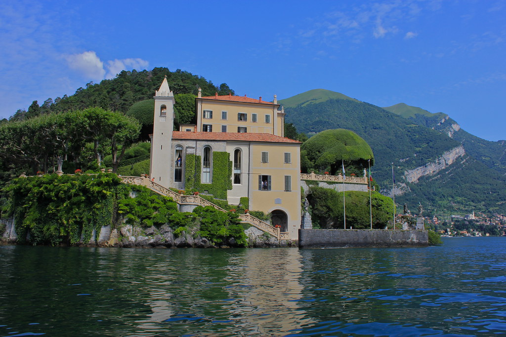 Historic villa and gardens on a green promontory over Lake Como