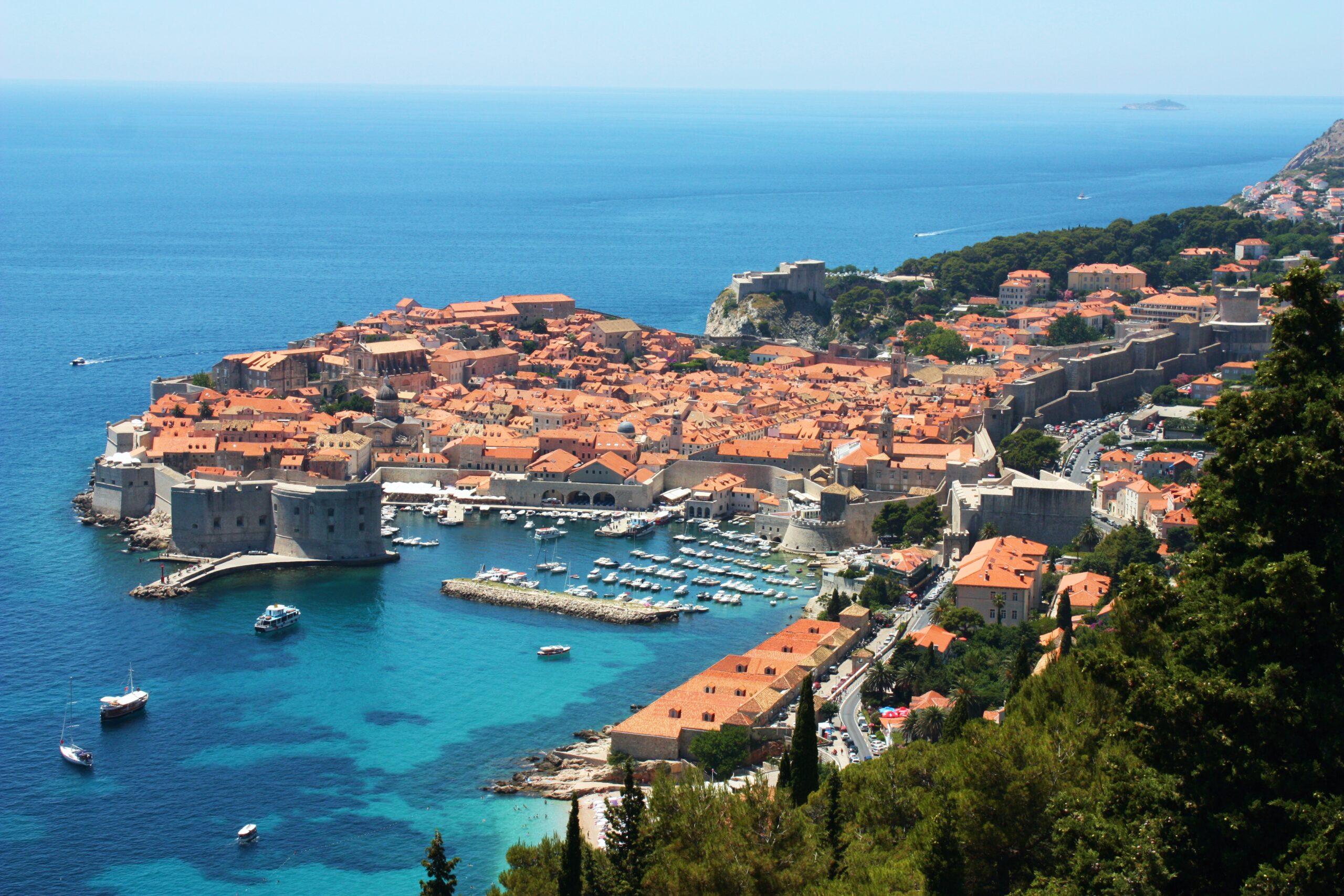 The red roofs and city walls of Dubrovnik old town above the blue Adriatic