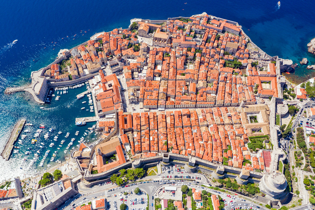 Aerial view of Dubrovnik's iconic city walls and the Old Town perched above the Adriatic Sea, Croatia