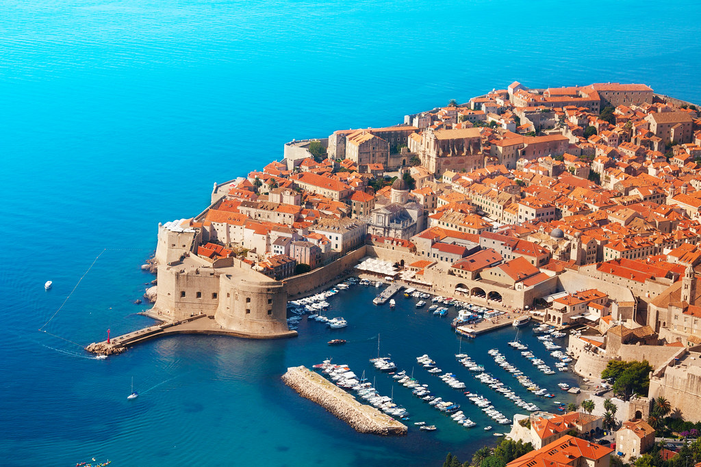 Colourful boats moored in the old town harbour of Dubrovnik, Croatia