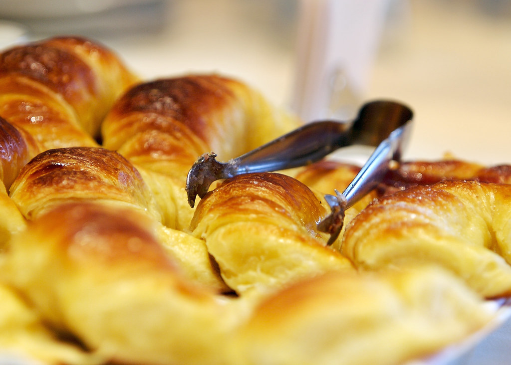 Fresh golden croissants at a bakery, the classic budget French breakfast