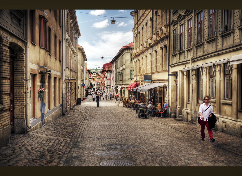 Cobbled main street of the Haga district in Gothenburg lined with cafes