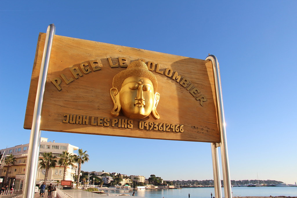 Sandy beach and blue water at Plage Le Colombier in Juan-les-Pins