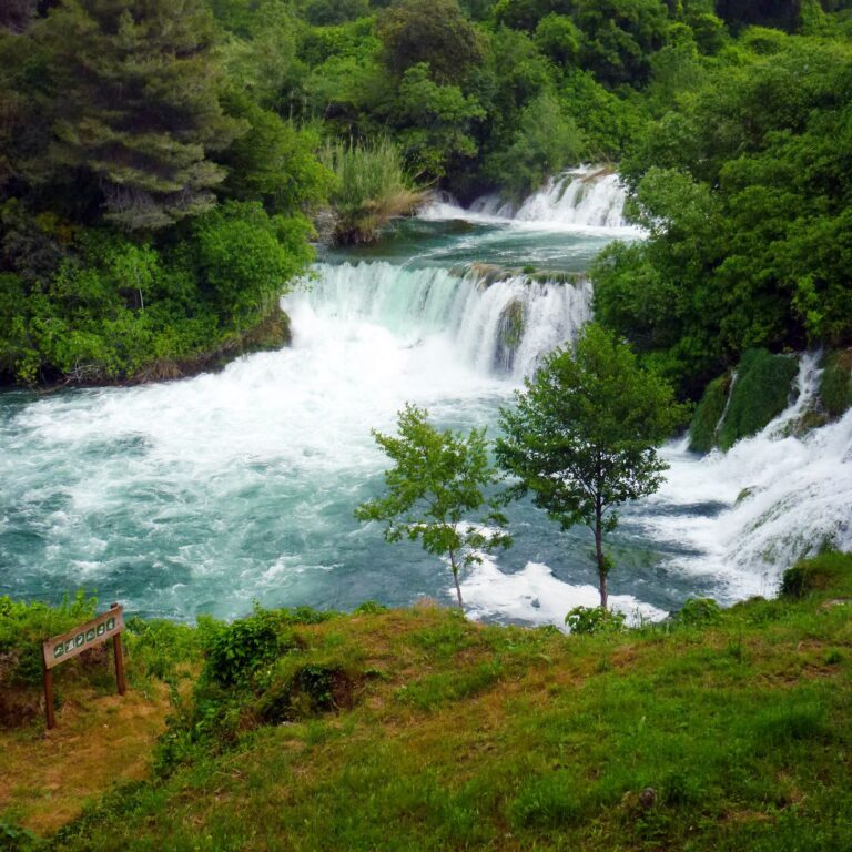 The Skradinski Buk waterfalls cascading through green forest in Krka National Park