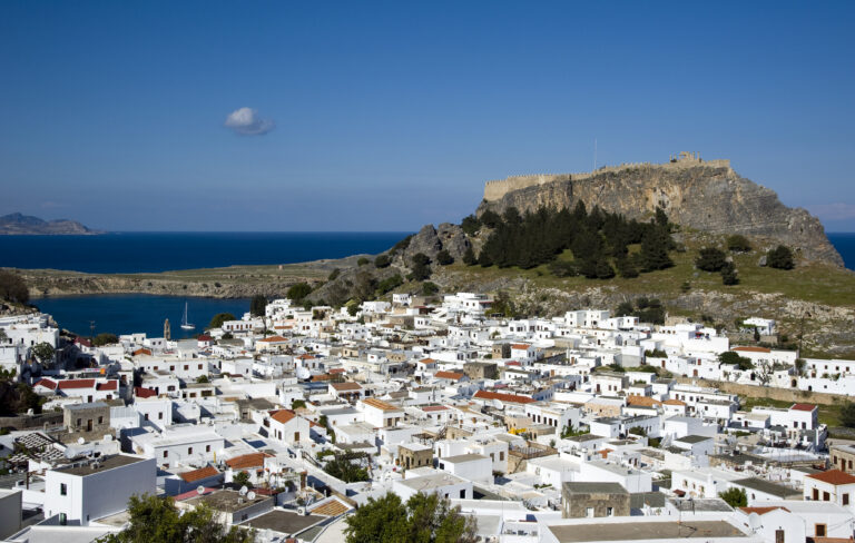 Whitewashed village of Lindos below its ancient acropolis on Rhodes, Greece