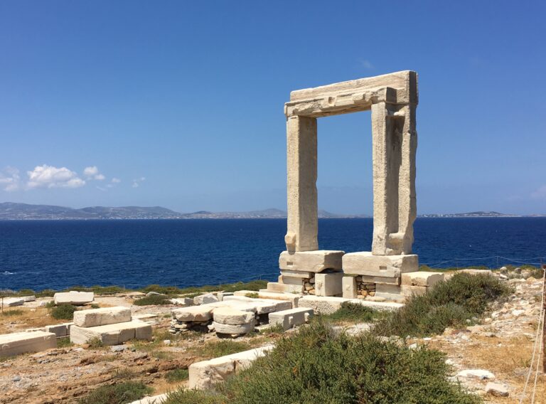 The Portara marble doorway standing above the sea on Palatia islet in Naxos, Greece