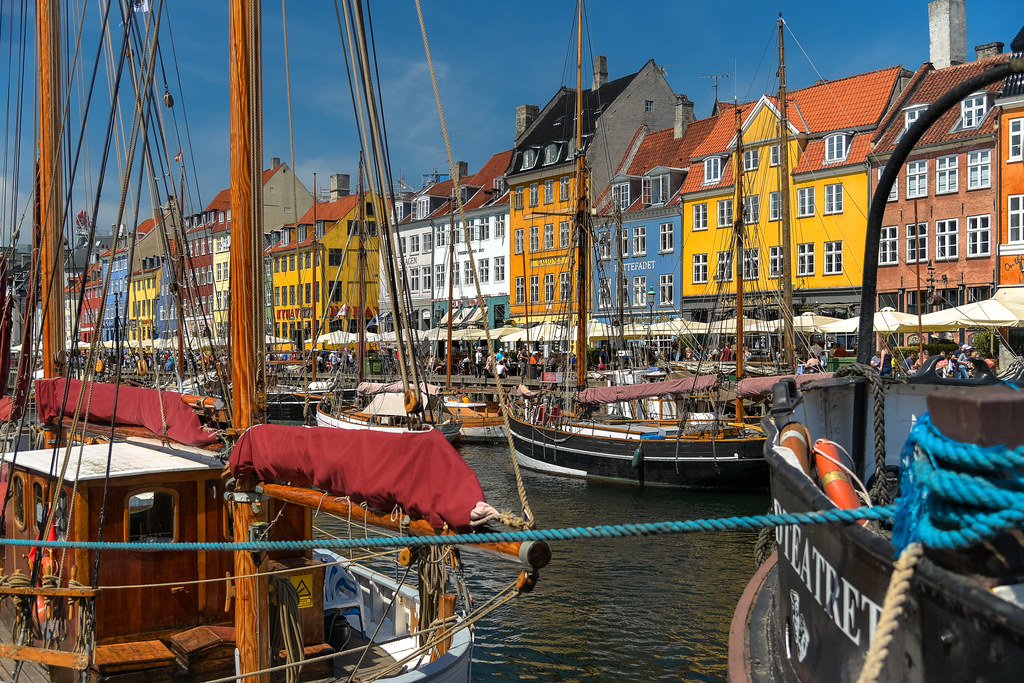 Colorful townhouses and boats along Nyhavn harbor in Copenhagen, Denmark